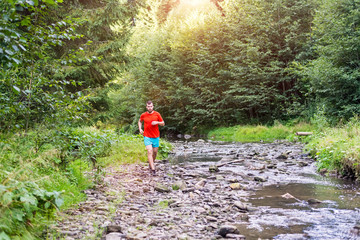 Young sportsman jogging in the beautiful sunset