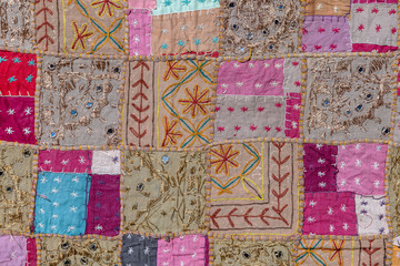 Detail patchwork carpet in India. Close up