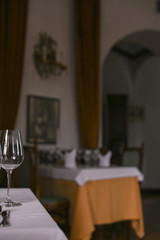 Interior of a classic restaurant in an old castle. Traveling in Europe. Served tables and antiquity.