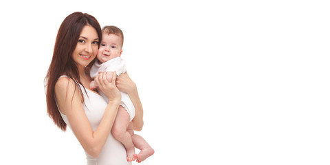 Portrait of mother and her little child in white. Happy family concept. Mother holding cute baby isolated on white background. . Motherhood and children concept. Close up - 294794583