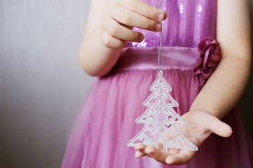 Christmas tree toy in children's hands