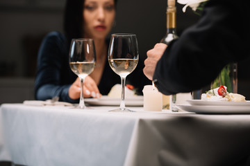 selective focus of young woman having romantic dinner with boyfriend