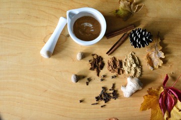 Some spices with mortar and autumn stuff, fall cozy flatlay, pumkin spice preparation, banner background with copyspace