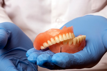 False teeth prosthesis. Doctor Dentist.