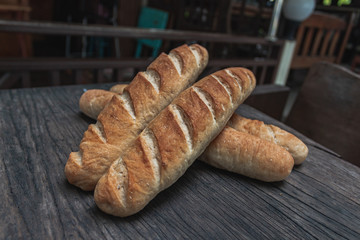 Baguette on a wooden table.