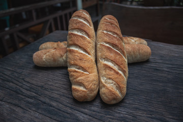 Baguette on a wooden table.