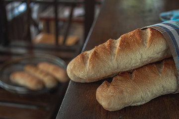 Baguette on a wooden table.