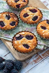 Mini blackberry bakewell tarts - high angle view