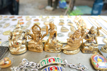 Buddhist amulet in stall at amulet selling market in thailand