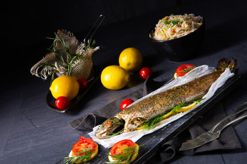 baked trout with herb filling and tomatoes