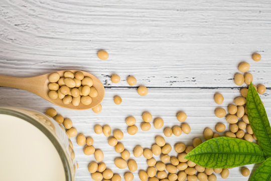 Soy milk and soy bean it on white table background,healthy concept. Benefits of Soy.