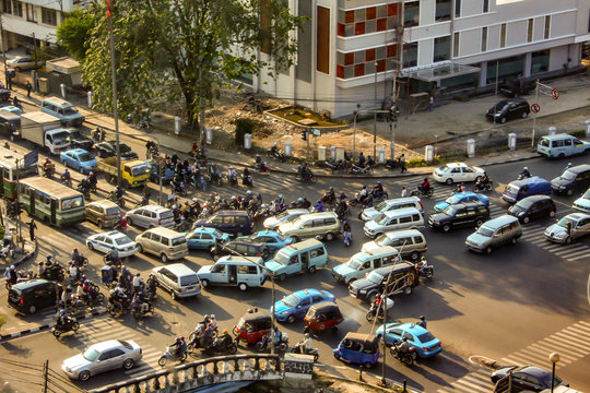 Jakarta, Indonesia - September 13, 2009: aerial view at a crossroad with many cars and motorbikes in a traffic jam