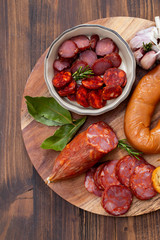 typical smoked portuguese sausages on wooden board