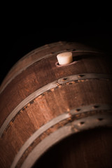 Wooden barrel in a dark cellar