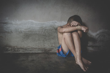 Victim boy with hands tied up with rope in emotional stress and pain,  kidnapped, abused, hostage, ...