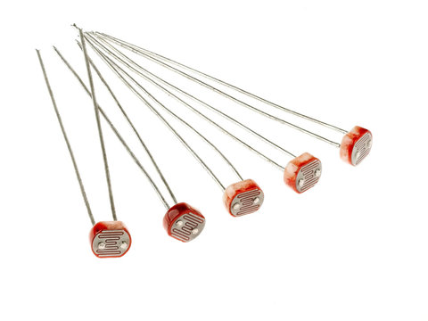 A group of photoresistors (or light-dependent resistor, LDR, or photo-conductive cell), isolated on white. They are light-controlled variable resistors. 