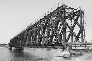 The metal bridge. Black and white photo. Old bridge