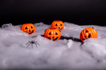 Holloween pumpkin and spider web decoration on a black background