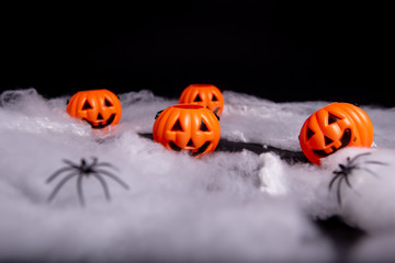 Holloween pumpkin and spider web decoration on a black background