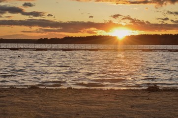 Beautiful colorful landscape. Sunset with a beautiful sky by the lake.
