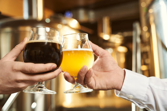 Two Glasses Of Dark And Light Beer Close Up.