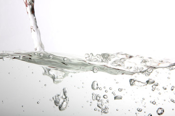 Water splash with bubbles of air, isolated on the white background.