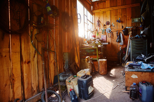 Workshop, shed, garage or storage room with tools for repair, chores, spare parts from various equipment.
