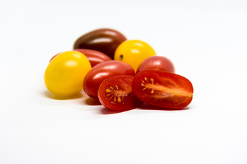 Fresh and colorful cherry tomatoes on white background