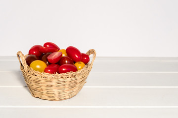 Fresh and colorful cherry tomatoes on white background