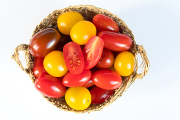 Fresh and colorful cherry tomatoes on white background