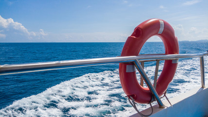 buoyancy hanging on white rack on a boat.