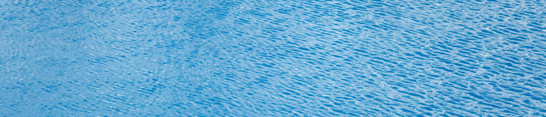 Fototapeta na wymiar blue water surface with waves background