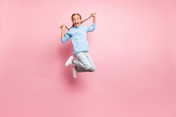 Full length body size photo of cheerful positive ecstatic overjoyed rejoicing girl jumping up...