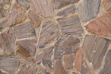 Texture wall of fragment from a chipped. Old stone wall texture background.