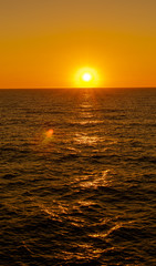 sunset over the ocean with an endless horizon 