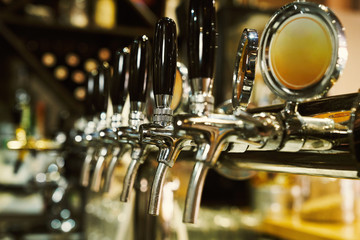 Obraz na płótnie Canvas Row of beer taps.