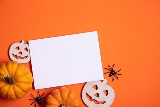 Blank white halloween card with pumpkins and spiders. Poster invitation mockup