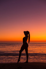 Fototapeta na wymiar Blonde model on the sunset in Greece