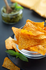 Nachos chips or corn mexican chips in glass bowl, isolated healthy food snack
