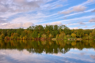 reflection of the autumn forest in the lake