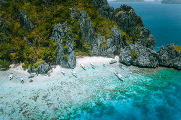 El Nido, Palawan, Philippines. Aerial view of tropical Island with tourist boats moored at white...