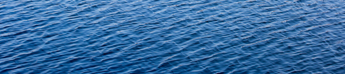 Naklejka premium blue water surface with waves background
