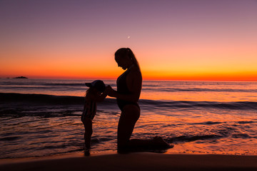 Mother and daughter at the sea 