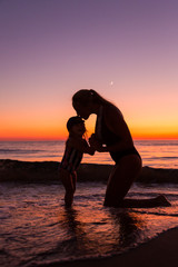 Mother and daughter at the sea 