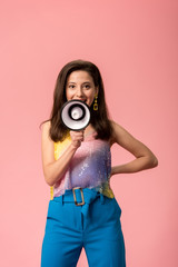 young stylish disco girl with megaphone isolated on pink