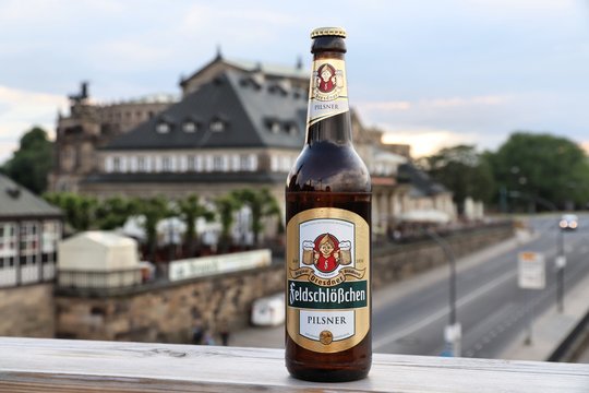 DRESDEN, GERMANY - MAY 10, 2018: Feldschlosschen pilsner beer bottle in Dresden. 1,300 breweries in Germany produce some 5,000 brands of beer.