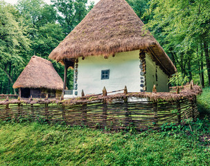 Captivating summer view of traditional romanian peasant houses. Nice rural scene of Transylvania,...