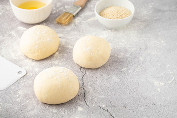 Dough pieces on the table in the kitchen. Copy space.