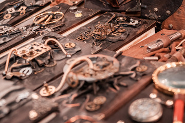 Steam punk Clockwork machinery and tools for time travelling. Hand made art, brass and golden details. Halloween theme, retro noir atmosphere. Industrial revolution concept.