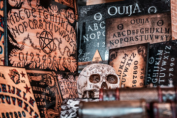 Talking board and planchette, also known as Ouija board, used for communicating with the dead and...